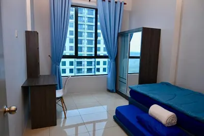 a bedroom with a bed and a large window at CK Home in Ipoh