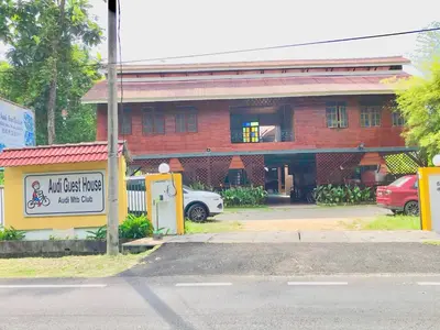 a building with a car parked in front of it at Junior Suite Nature of Penang Guesthouse in Balik Pulau