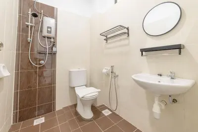 a bathroom with a toilet and a sink and a mirror at 7 \u53f7 Kota Cozy Homestay 3 storey 22pax-7 Room-SingK in Gua Sai