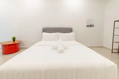 a large white bed with two white pillows on it at 7 \u53f7 Kota Cozy Homestay 3 storey 22pax-7 Room-SingK in Gua Sai