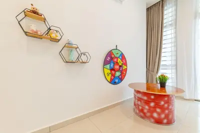a room with a table and a mirror on the wall at 7 \u53f7 Kota Cozy Homestay 3 storey 22pax-7 Room-SingK in Gua Sai