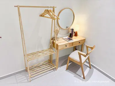 a dressing table with a mirror and a chair at HH Villa Private Pool Bercham Ipoh in Ipoh