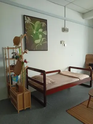a bedroom with two bunk beds and a shelf at Bajet Homestay - Teratak Singgah in Seri Iskandar