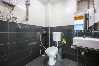 a bathroom with a toilet and a sink at Modern Family Suite in Tanah Rata Cameron Highlands Clover Home K2 in Cameron Highlands