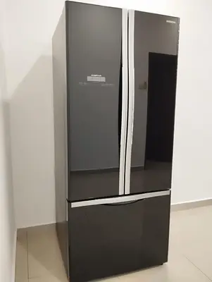 a large black refrigerator sitting in a room at Ipoh Home Story Newly Renovated Bercham Landed Double Storey For 10pax in Ipoh