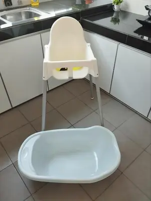 a white chair sitting in a kitchen next to a sink at Ipoh Home Story Newly Renovated Bercham Landed Double Storey For 10pax in Ipoh