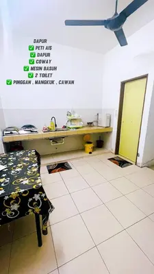 a room with a desk and a table in it at APPARTMENT Samudera Manjung Point in Seri Manjung