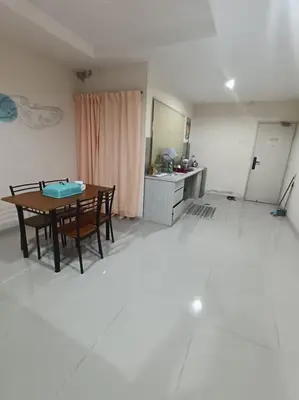 a dining room with a table and chairs in a room at Marina Island Lumut in Lumut