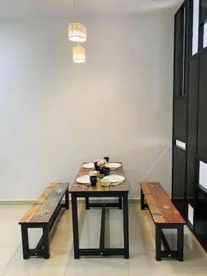 a table and two benches in a room at BBF Cozy Hub in Kamunting