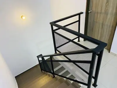 a black metal shelf sitting in a room at BBF Cozy Hub in Kamunting