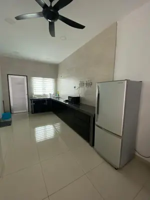 a kitchen with a refrigerator and a ceiling fan at BBF Cozy Hub in Kamunting