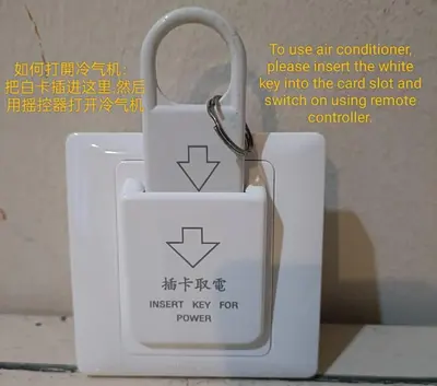 a white key padlock with a key chain on it at HuttonSTAY at Georgetown in George Town