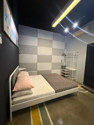 a bedroom with a bed in a room at HuttonSTAY at Georgetown in George Town