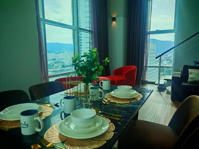 a dining room table with a view of a city at Maritime Suite by Ocean Luxe 2BR Seaview Dryer Water Dispenser in George Town