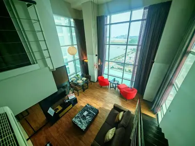 an overhead view of a living room with large windows at Maritime Suite by Ocean Luxe 2BR Seaview Dryer Water Dispenser in George Town