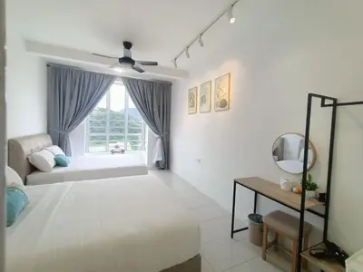 a white bedroom with a bed and a window at Dream 7 at Emerald avenue in Brinchang