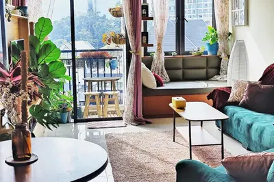 a living room with a couch and a table at #MyUrbanGetaway at CameronFair, Cameron Highlands in Tanah Rata