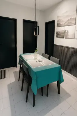 a dining room with a blue table and chairs at 4BR Near SPICE Arena Free Parking in Bayan Lepas