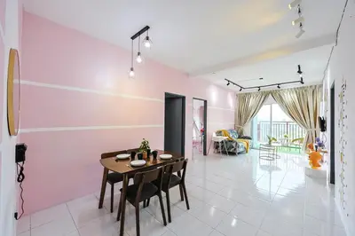 a dining room with pink walls and a table and chairs at Pokemon Theme With kids Playground Brinchang Cameron Highland -Clover Home G-15 in Brinchang