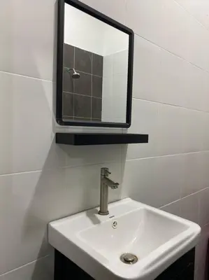 a bathroom with a sink and a mirror at Mslim only Homestay Aleena Gua Musang in Gua Musang