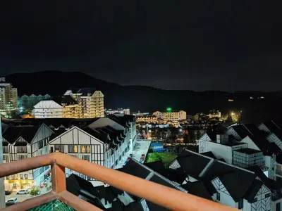 a view of a city at night with buildings at Almira Homestay in Brinchang