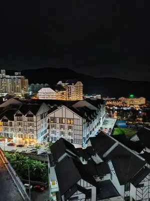 a view of a city at night with buildings at Almira Homestay in Brinchang