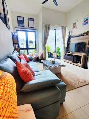 a living room with a couch and a tv at #MyMidoriGetaway , CameronFair, Cameron Highlands in Tanah Rata