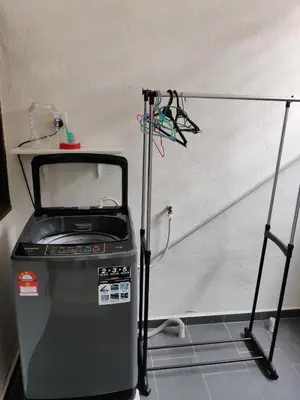 a small machine sitting in a room with a wall at CLP perai homestay near Sri Muniswarar temple in Perai