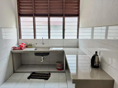 a small kitchen with a sink and a window at CLP perai homestay near Sri Muniswarar temple in Perai