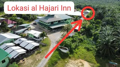 an aerial view of a house with a red arrow pointing to a home at al Hajari Inn - For Islam Only - Kg Banggol Batu Lenggong in Kampong Banggol Belimbing