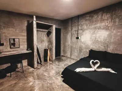 a bedroom with a bed with a heart decoration on it at Afqa Nest Industrial Charm in Gua Sai
