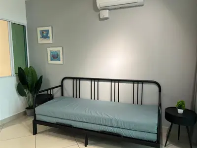a bed in a room with a white wall at Mansion One l 7pax 2R1B l Seaview l Gleneagles l by PerfectSweetHome in George Town