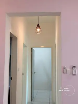 a hallway with a white door and a light fixture at Meritus Residence 4min to Penang Bridge in Perai