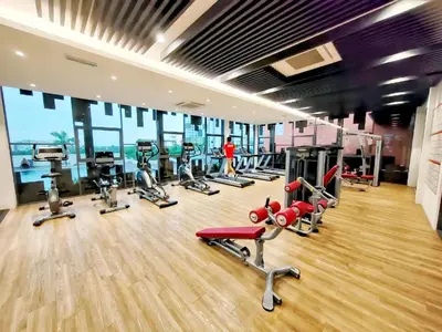 a gym with a bunch of treadms and machines at Meritus Residence 4min to Penang Bridge in Perai
