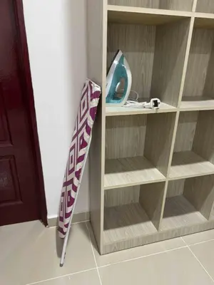 a book shelf with an umbrella in a room at 25 pax Golf Resort Private Villa in Kulim
