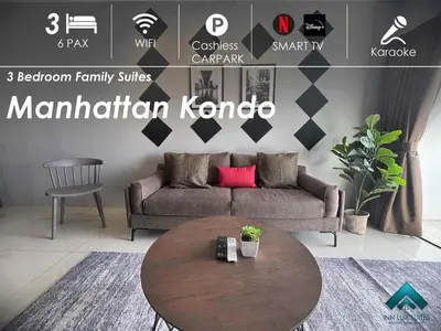 a living room with a couch and a table at Manhattan Ipoh Family Suites By Inn Lux in Ipoh