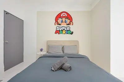 a bedroom with a bed with a super mario sign on the wall at Mario Inspired Highlands Escape Family Homestay Brinchang - Clover Home 5-20 in Brinchang