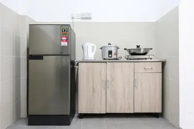 a kitchen with a stainless steel refrigerator and wooden cabinets at Mario Inspired Highlands Escape Family Homestay Brinchang - Clover Home 5-20 in Brinchang