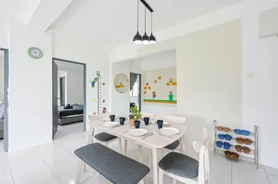 a white dining room with a white table and chairs at Mario Inspired Highlands Escape Family Homestay Brinchang - Clover Home 5-20 in Brinchang