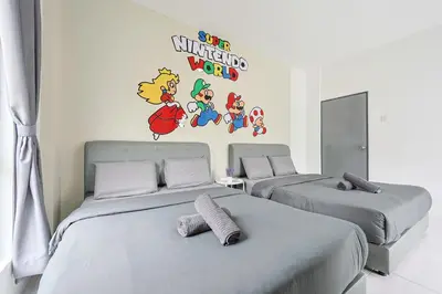 a bedroom with two beds and a sticker on the wall at Mario Inspired Highlands Escape Family Homestay Brinchang - Clover Home 5-20 in Brinchang
