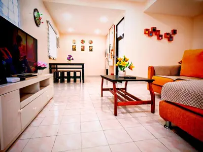 a living room with a couch and a table at Ipoh Happy Home Boutique Villa by City Home Empire in Ipoh