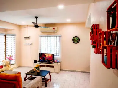 a living room with a couch and a tv at Ipoh Happy Home Boutique Villa by City Home Empire in Ipoh