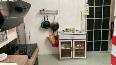 a small kitchen with a stove and some pots and pans at KKB Gathering Home - Private Room in Shared House in Kuala Kubu Baharu