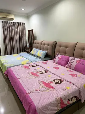 a bedroom with a large bed with a pink blanket at KKB Gathering Home - Private Room in Shared House in Kuala Kubu Baharu