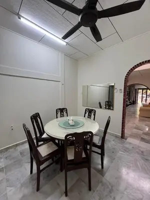 a dining room with a table and chairs and a ceiling fan at KKB Gathering Home - Private Room in Shared House in Kuala Kubu Baharu