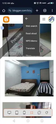 a picture of a bedroom with a bed and a website at Dales Guest House in Perai