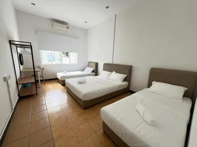 a hotel room with two beds and a mirror at MyRoom-Victoria, near to Island,LGL,Jln Burmah in George Town