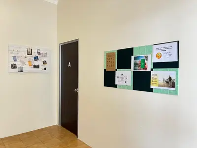 a hallway with a door and a wall with posters at MyRoom-Victoria, near to Island,LGL,Jln Burmah in George Town