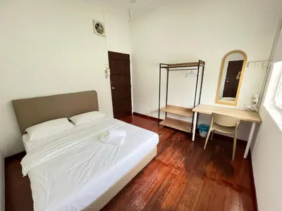 a bedroom with a bed and a desk and a mirror at MyRoom-Victoria, near to Island,LGL,Jln Burmah in George Town