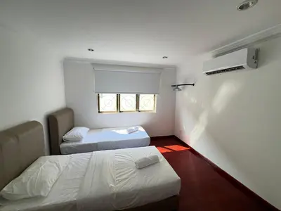 a bedroom with two beds and a window at MyRoom-Victoria, near to Island,LGL,Jln Burmah in George Town